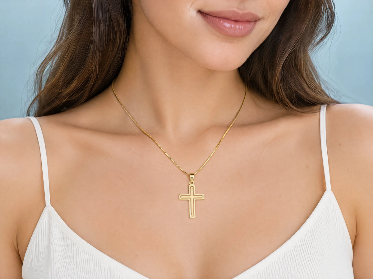 Openwork cross pendant S size worn for scale, 14 x 20 mm.