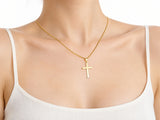 Smooth cross pendant S size worn for scale, 14 x 20 mm.