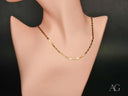 Sleek 18K solid gold piastrine chain necklace on mannequin
