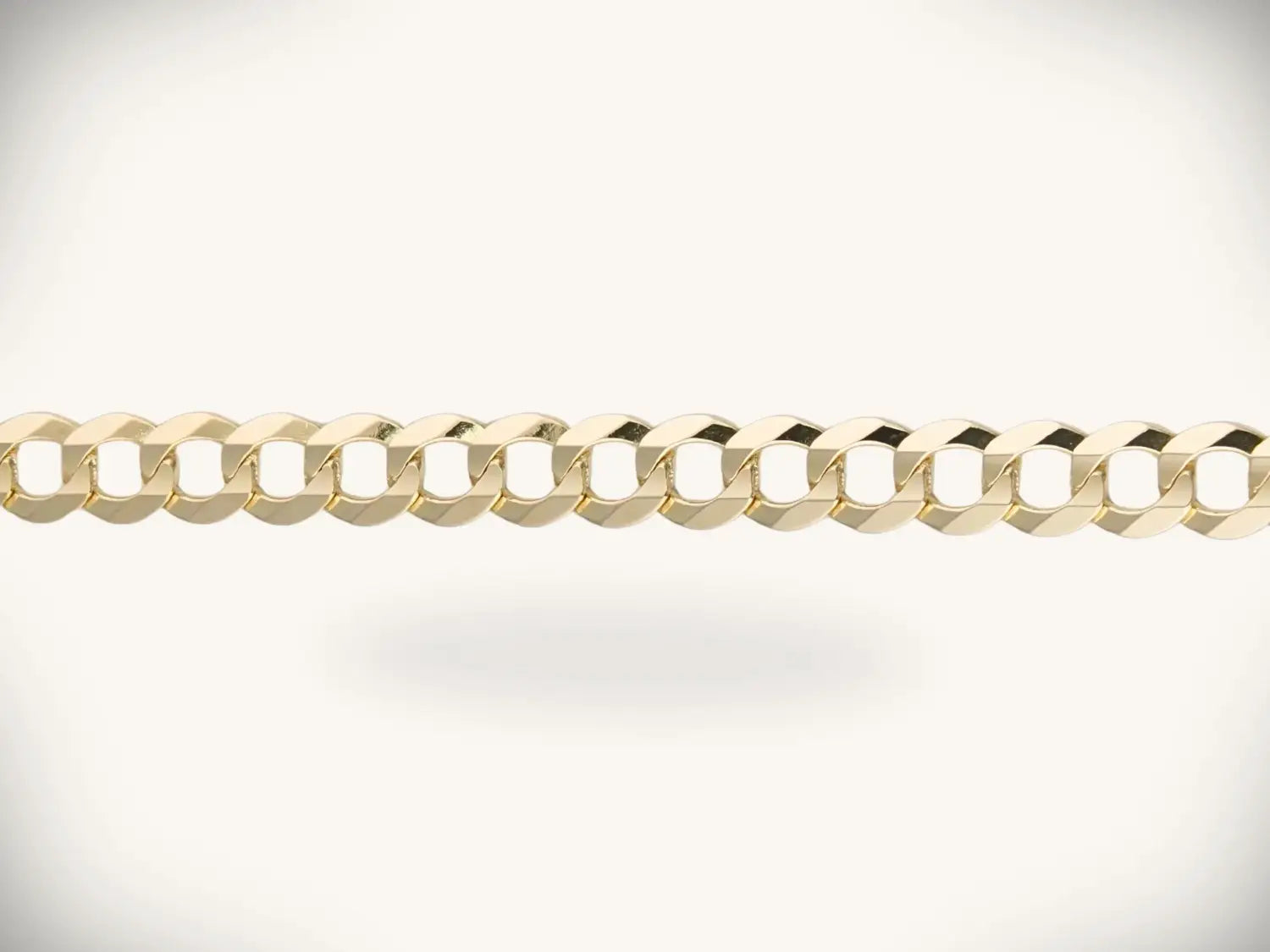 a sleek gold-toned curb chain with polished interlocking links exemplifying fine jewelry from ancient cleopatra styles to art deco gold jewelry evolution