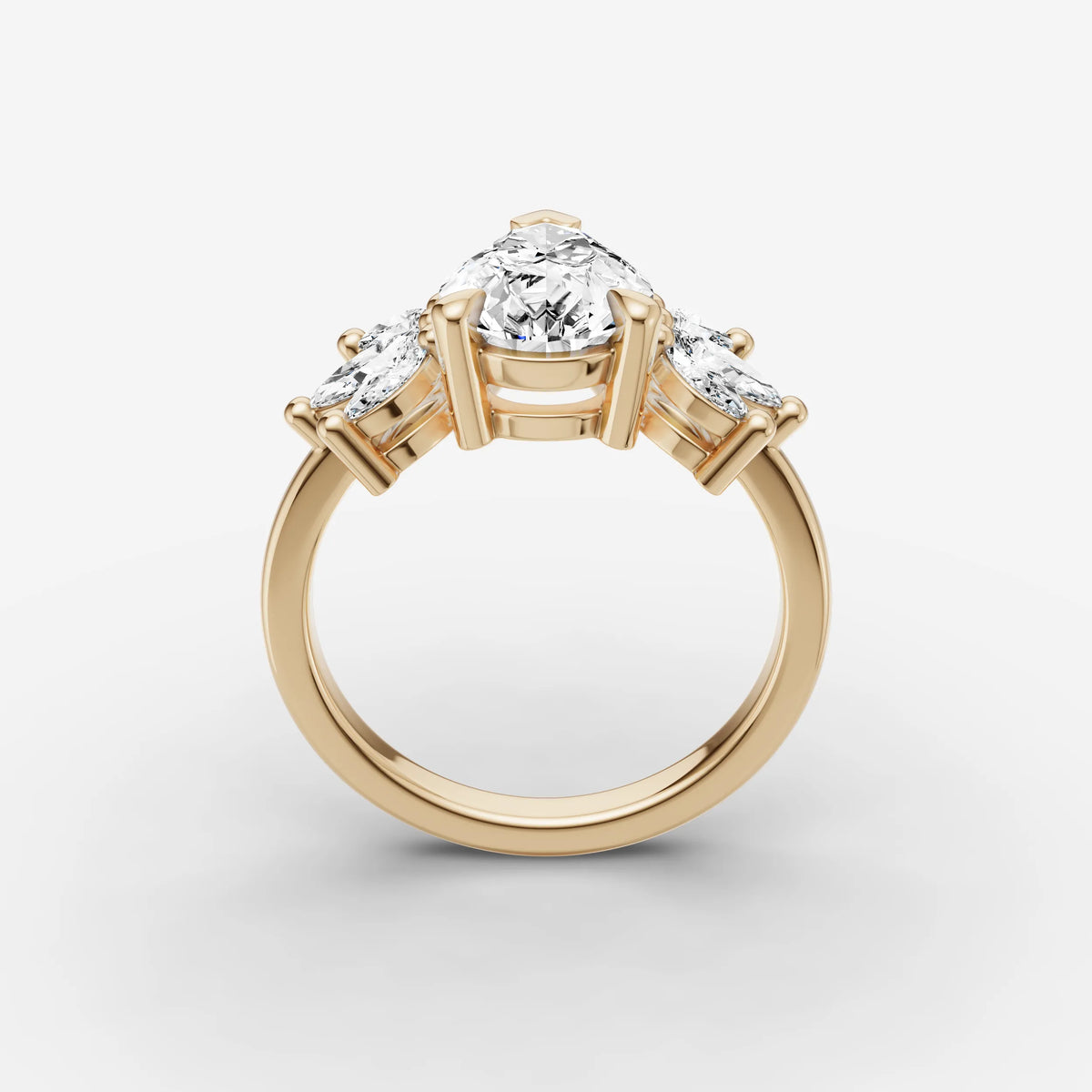 Fleur pear diamond setting in gold, side view