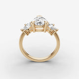 Fleur pear diamond setting in gold, side view