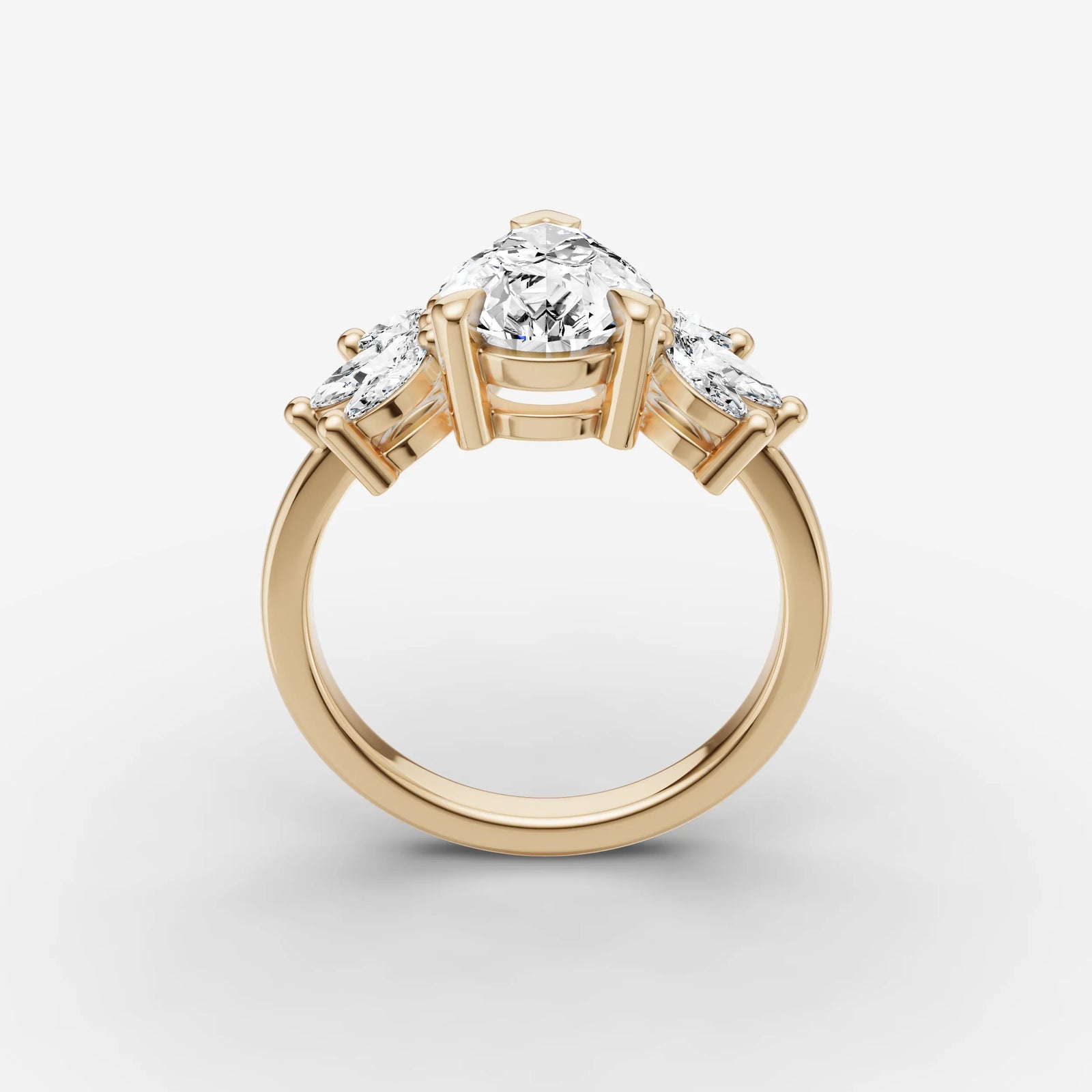Fleur pear diamond setting in gold, side view