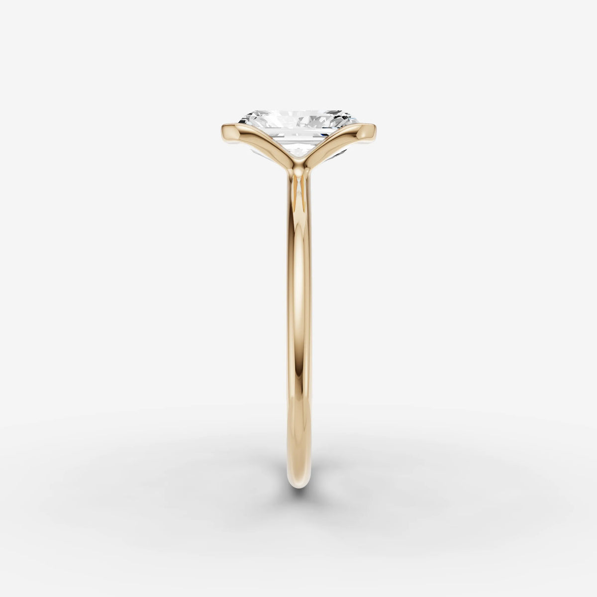 Demi radiant diamond setting in gold, angled view
