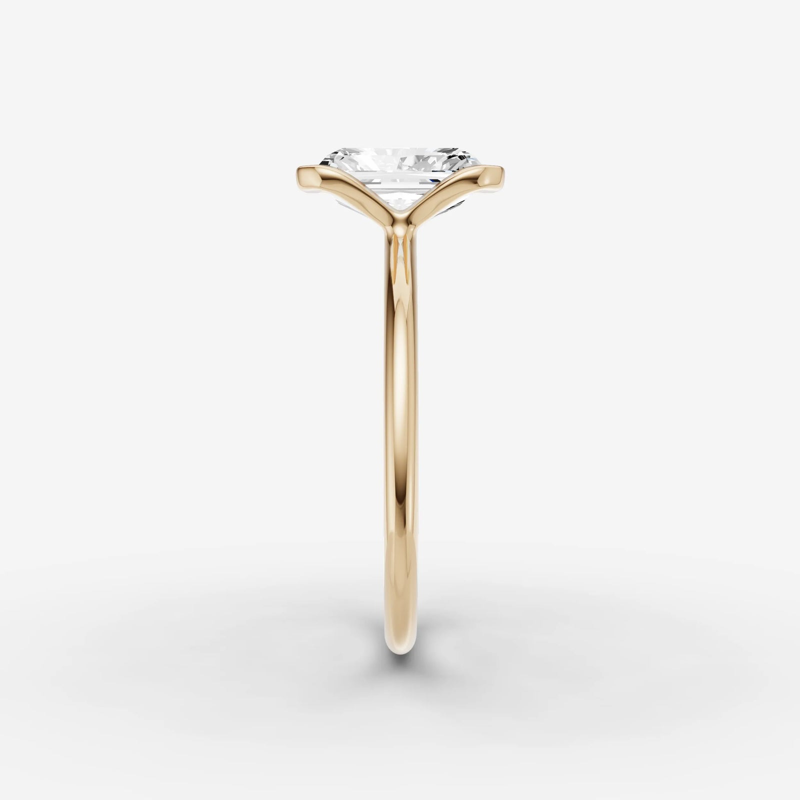 Demi radiant diamond setting in gold, angled view