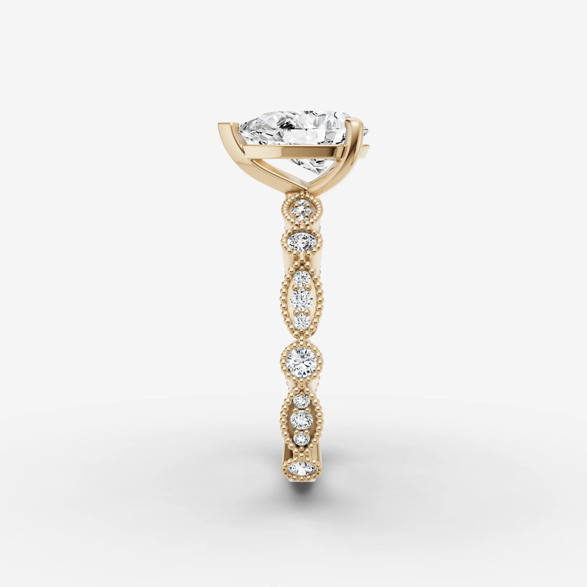 Heritage pear diamond setting in gold, angled view