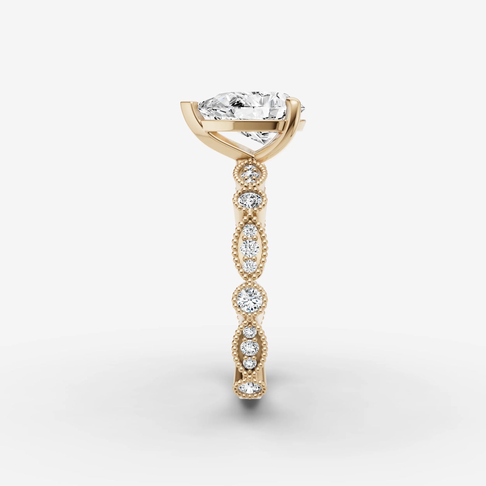 Heritage pear diamond setting in gold, angled view
