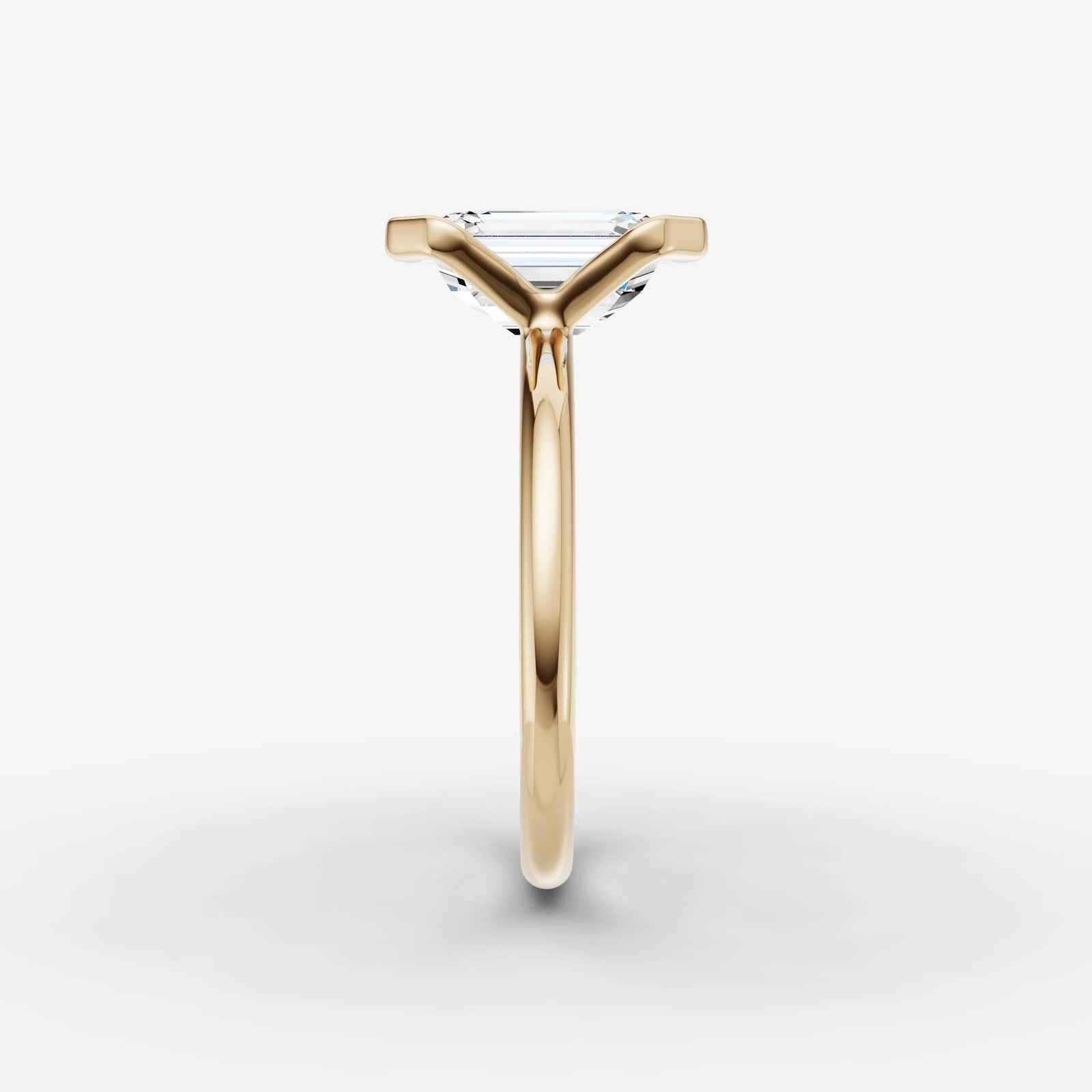 Demi emerald diamond setting in gold, angled view