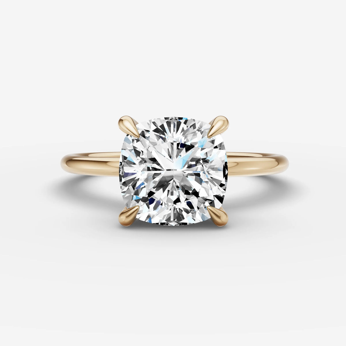 Mystere cushion diamond setting in gold, front view
