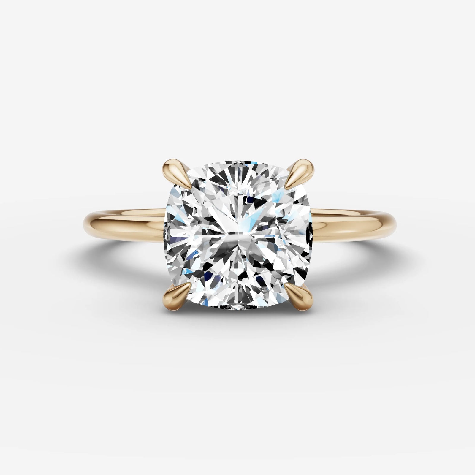 Mystere cushion diamond setting in gold, front view