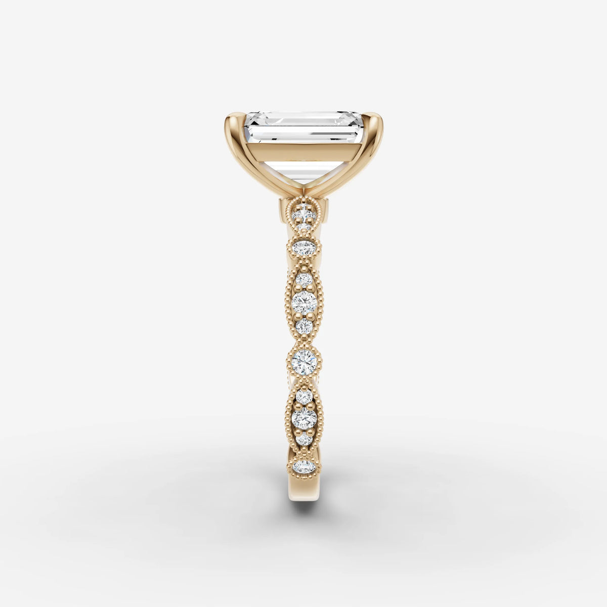 Heritage emerald diamond setting in gold, angled view