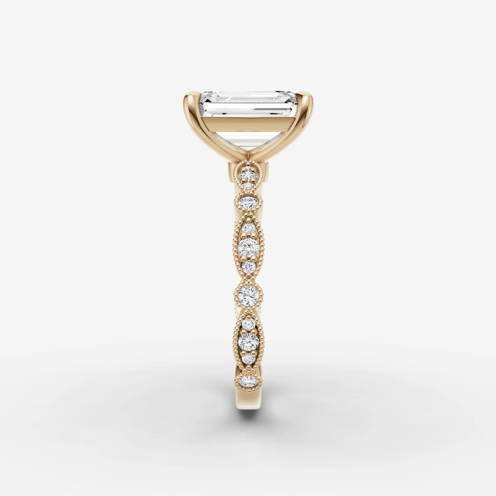 Heritage emerald diamond setting in gold, angled view