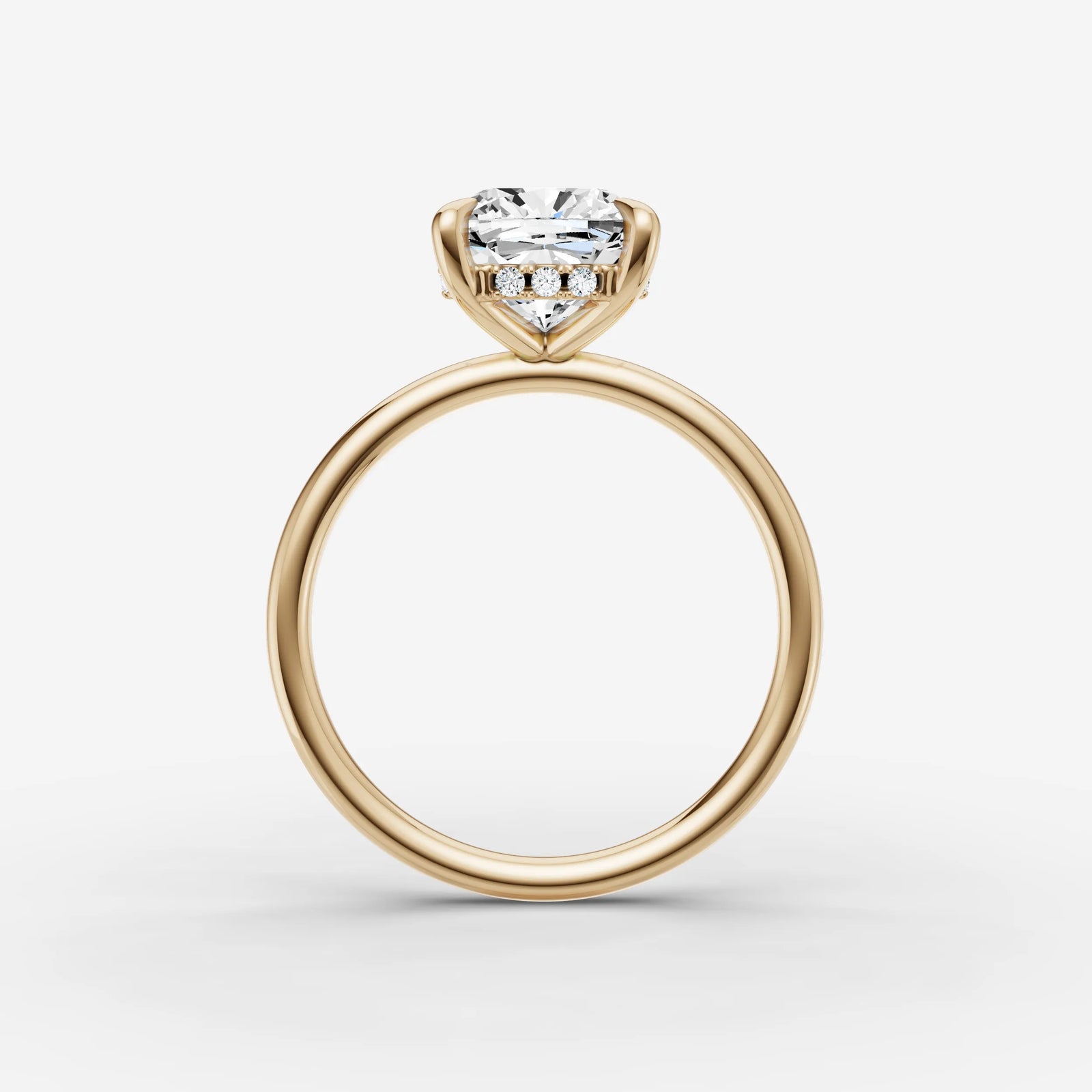 Mystere cushion diamond setting in gold, profile angle