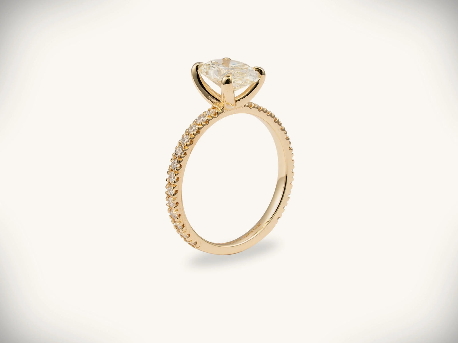 Soleil Pavé 18k gold oval diamond engagement ring with cushion-cut center stone