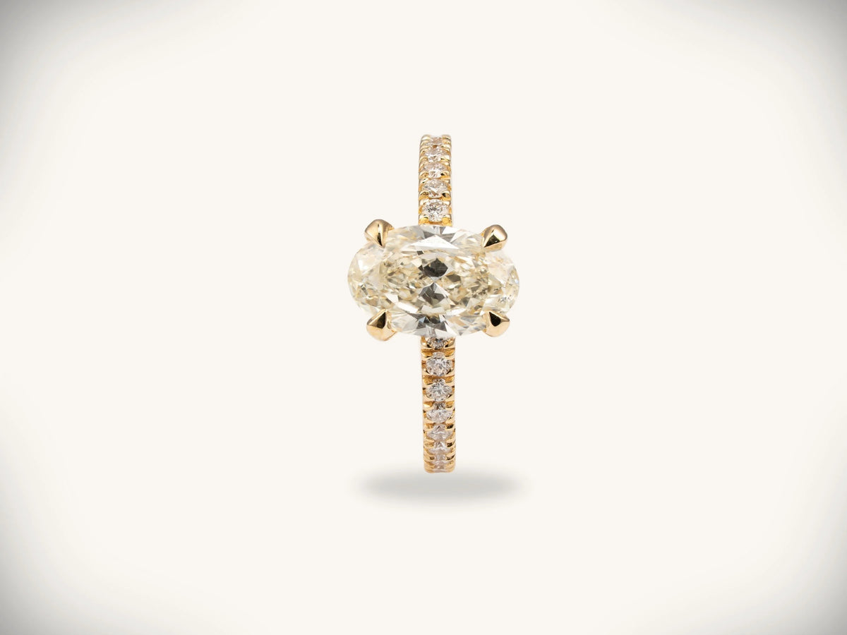 Soleil Pavé oval diamond engagement ring in 18k gold with pavé band