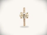 Soleil Pavé oval diamond engagement ring in 18k gold with pavé band