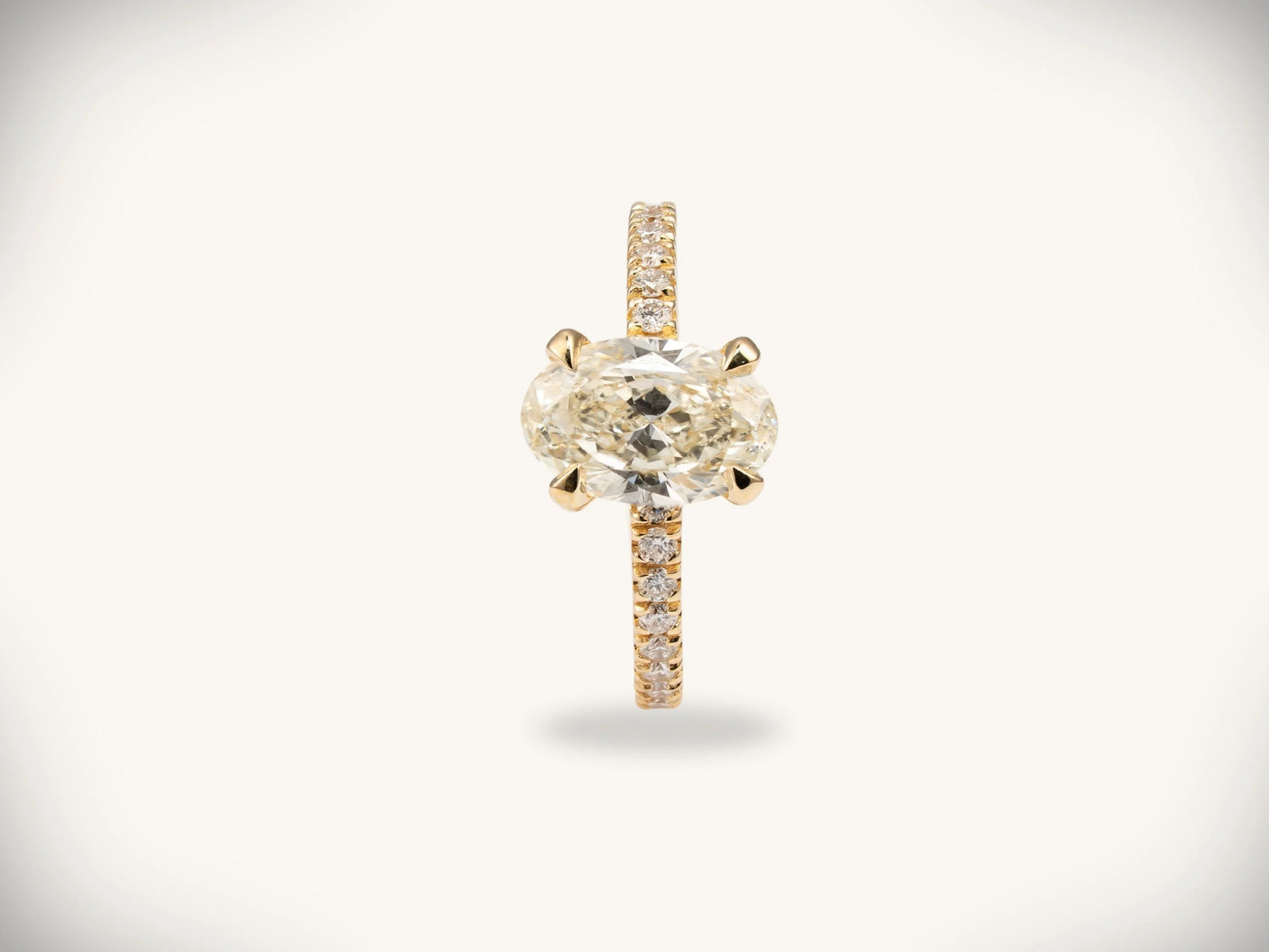 Soleil Pavé oval diamond engagement ring in 18k gold with pavé band