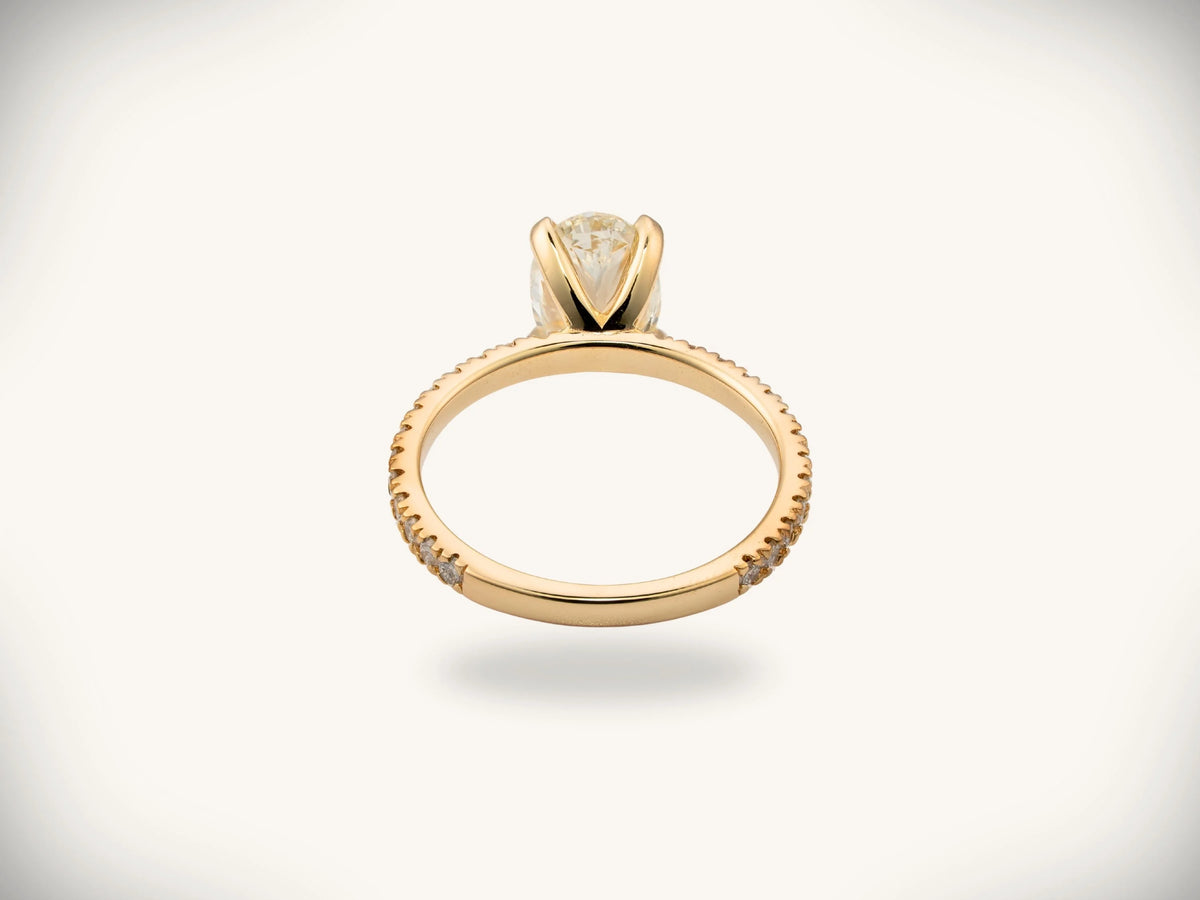 Soleil Pavé oval diamond engagement ring in 18k gold with pavé band