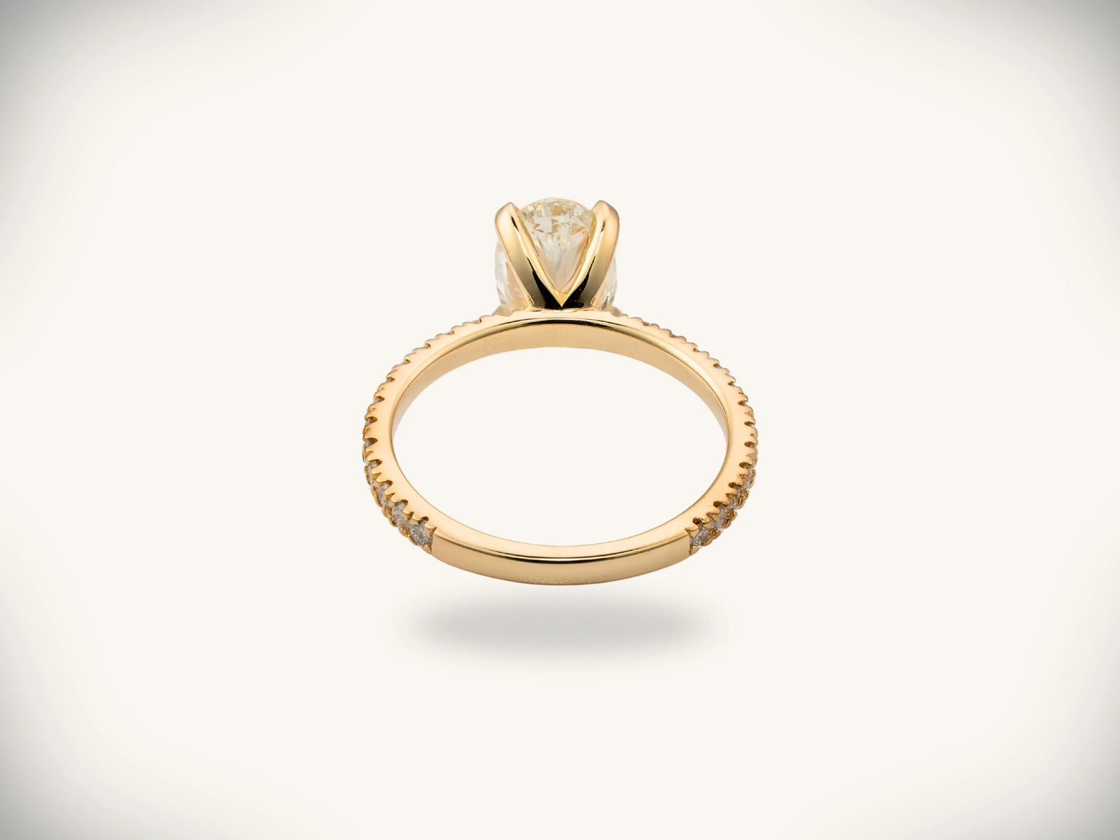 Soleil Pavé oval diamond engagement ring in 18k gold with pavé band