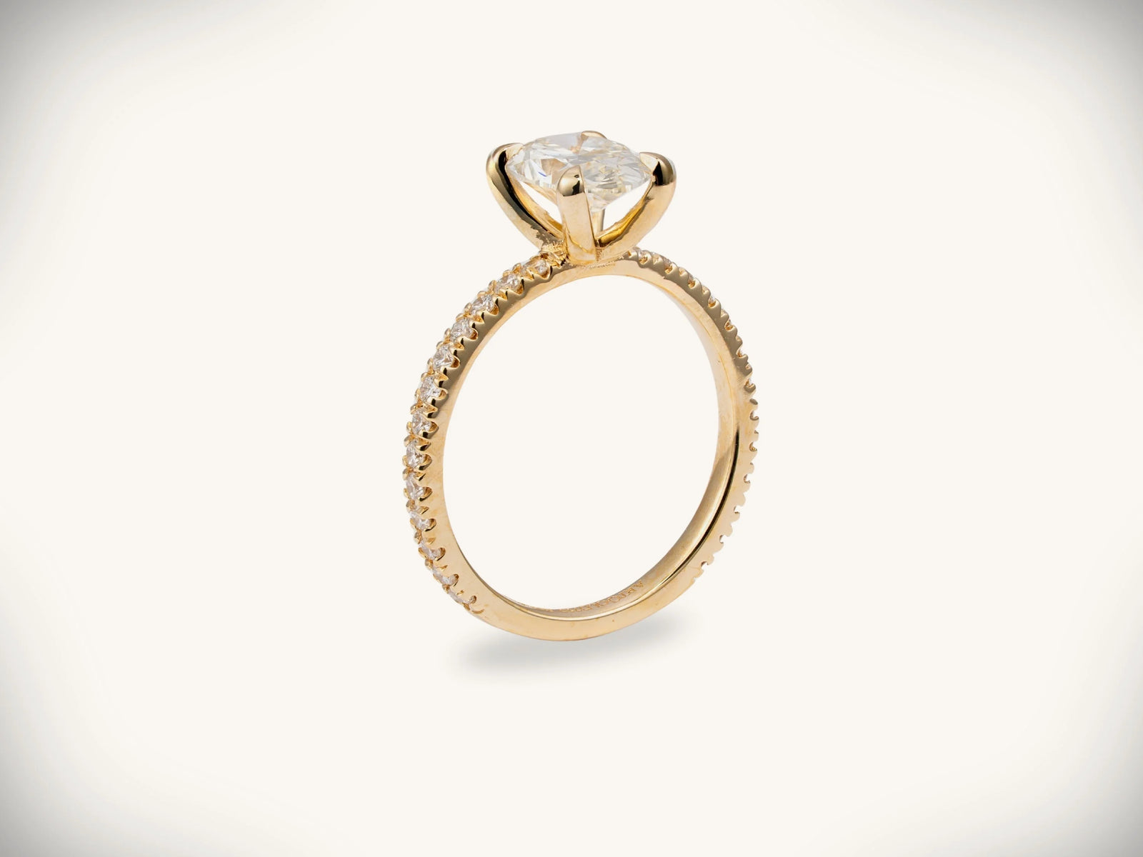 Soleil Pavé 18k gold oval diamond engagement ring with pavé band