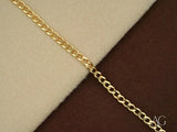 Solid 18k gold Cuban link bracelet with curb chain and lobster lock