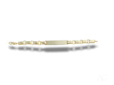 Solid 18k gold kid’s ID bracelet with unique chain links and gold flat plate