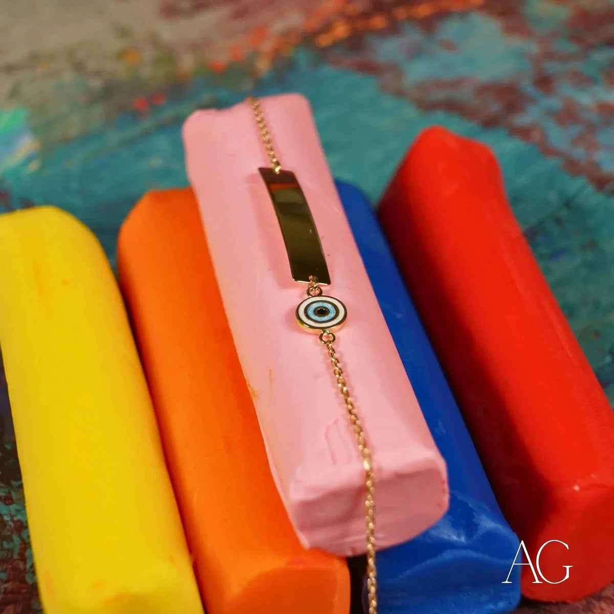 Solid gold kids ID bracelet with evil eye motif and customizable ID plate