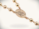 Solid gold rosary necklace with angelic medallion and emerald diamond cross