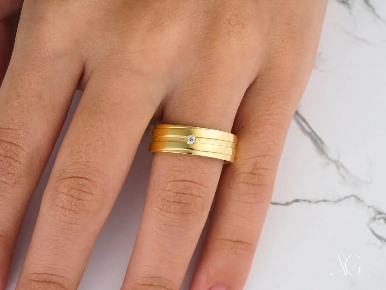 Solitaire Grace gold band ring with half-point diamond from Art Gold Jewelry
