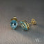 Elegant art gold jewelry featuring blue topaz earrings in the Greater Boston Area