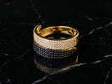 Sophisticated contrast 18K gold ring with overlapping bands set with white and black CZ stones, side view