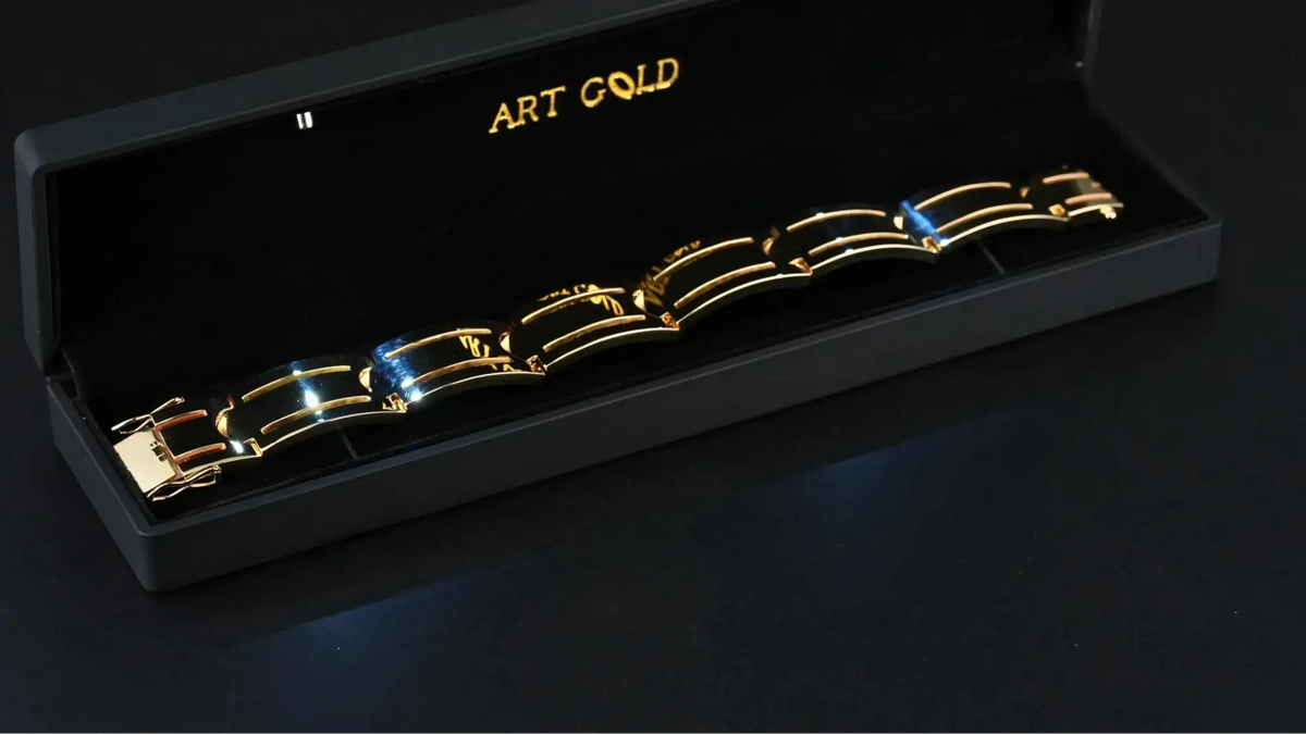 Sovereign Bracelet: solid gold with black segments in display box