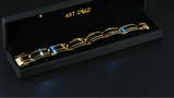 Sovereign Bracelet: solid gold with black segments in display box