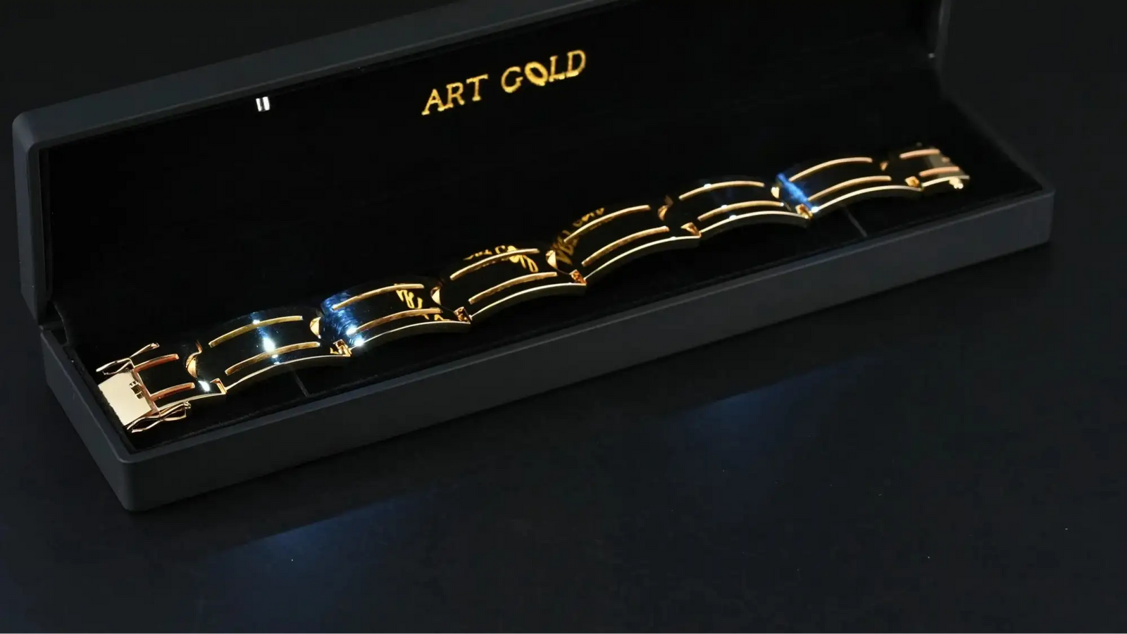 Sovereign Bracelet: solid gold with black segments in display box