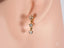 Elegant stars drop earrings in certified 18k solid gold with three clear gemstones