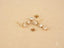 Gold-toned stars drop earrings with clear gemstones, crafted in certified 18k solid gold art jewelry