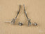 Stellar Bloom 18k White Gold Diamond Earrings with silver-colored stud and drop design