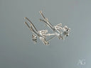 Stellar Bloom 18k white gold diamond dangle earrings with curved strands