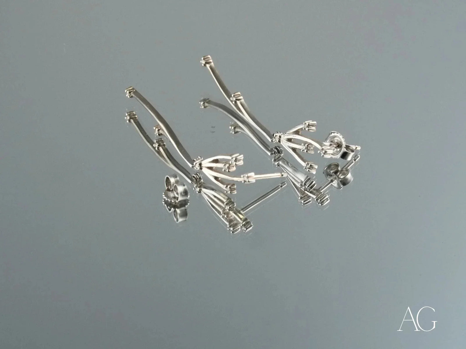 Stellar Bloom 18k white gold diamond dangle earrings with curved strands