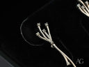 Stellar Bloom 18k white gold diamond earrings with delicate branches and sparkling stones
