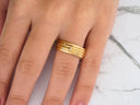 Stellar Strands gold wedding band with sleek gold lines and diamonds