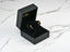 18k gold citrine and rubellite earrings with red gemstones in a black jewelry box