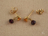 18k gold citrine and rubellite earrings with dangling purple stones