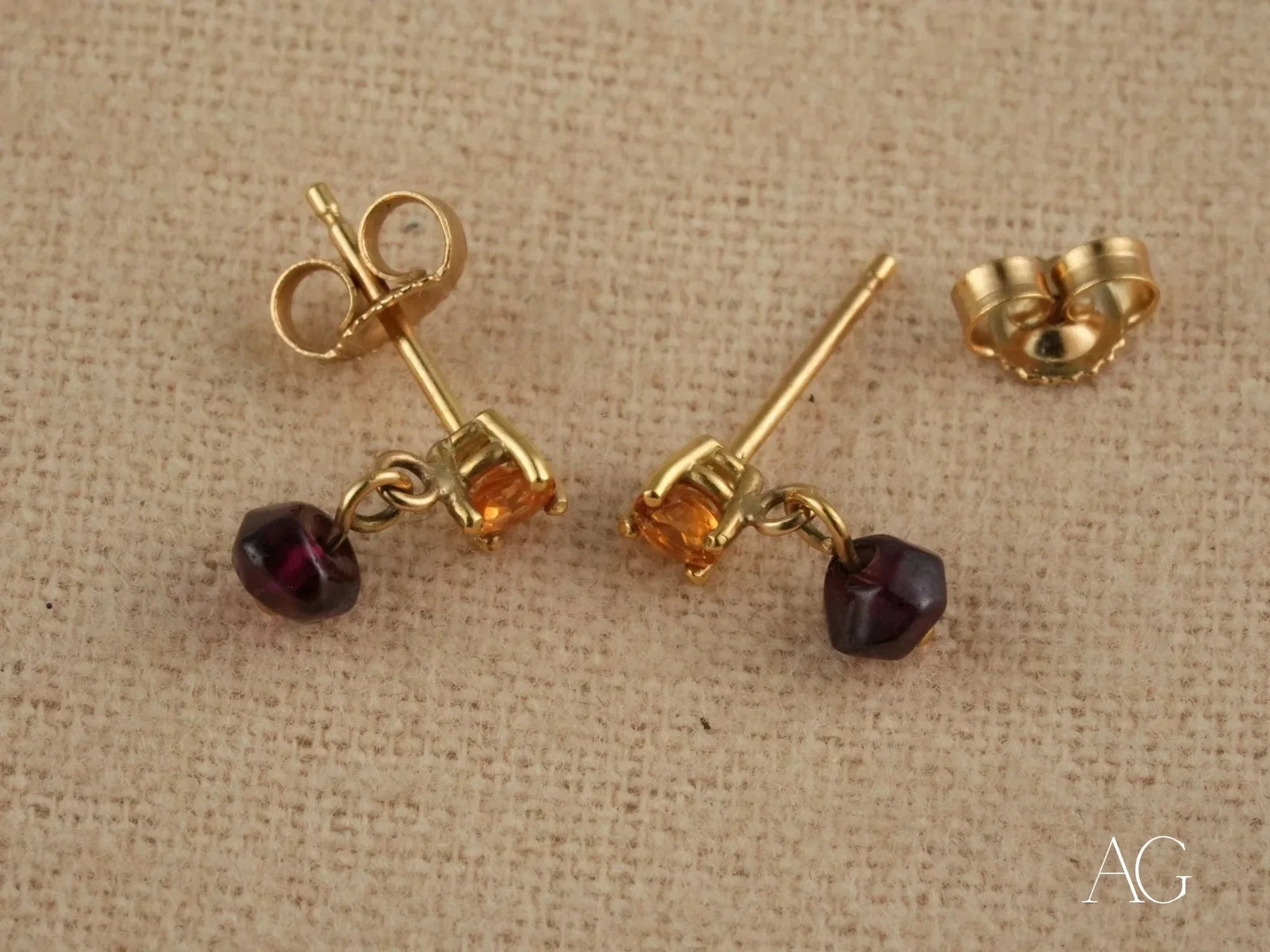 18k gold citrine and rubellite earrings with dangling purple stones