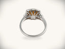 Sunset halo ring in silver-toned white gold with amber gem and diamonds