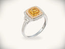 Sunset halo ring with square yellow diamond in platinum halo