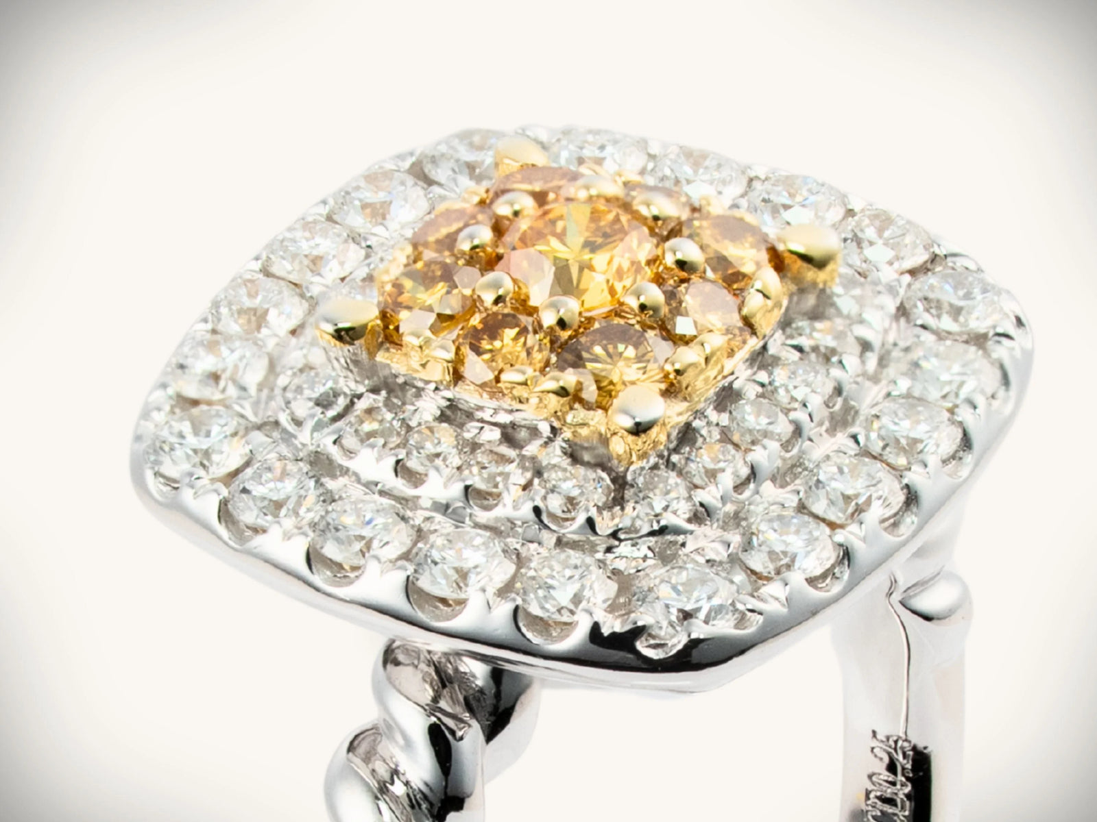 Sunshine Cushion Ring: two-tone gold jewelry with yellow diamond cluster halo in white gold