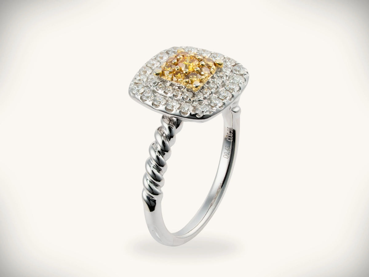 Sunshine cushion ring with radiant yellow diamond halo in white gold