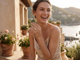 Woman in sunshine cushion white gold ring with beige satin slip dress