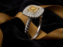 Sunshine cushion ring with yellow diamond halo in white gold